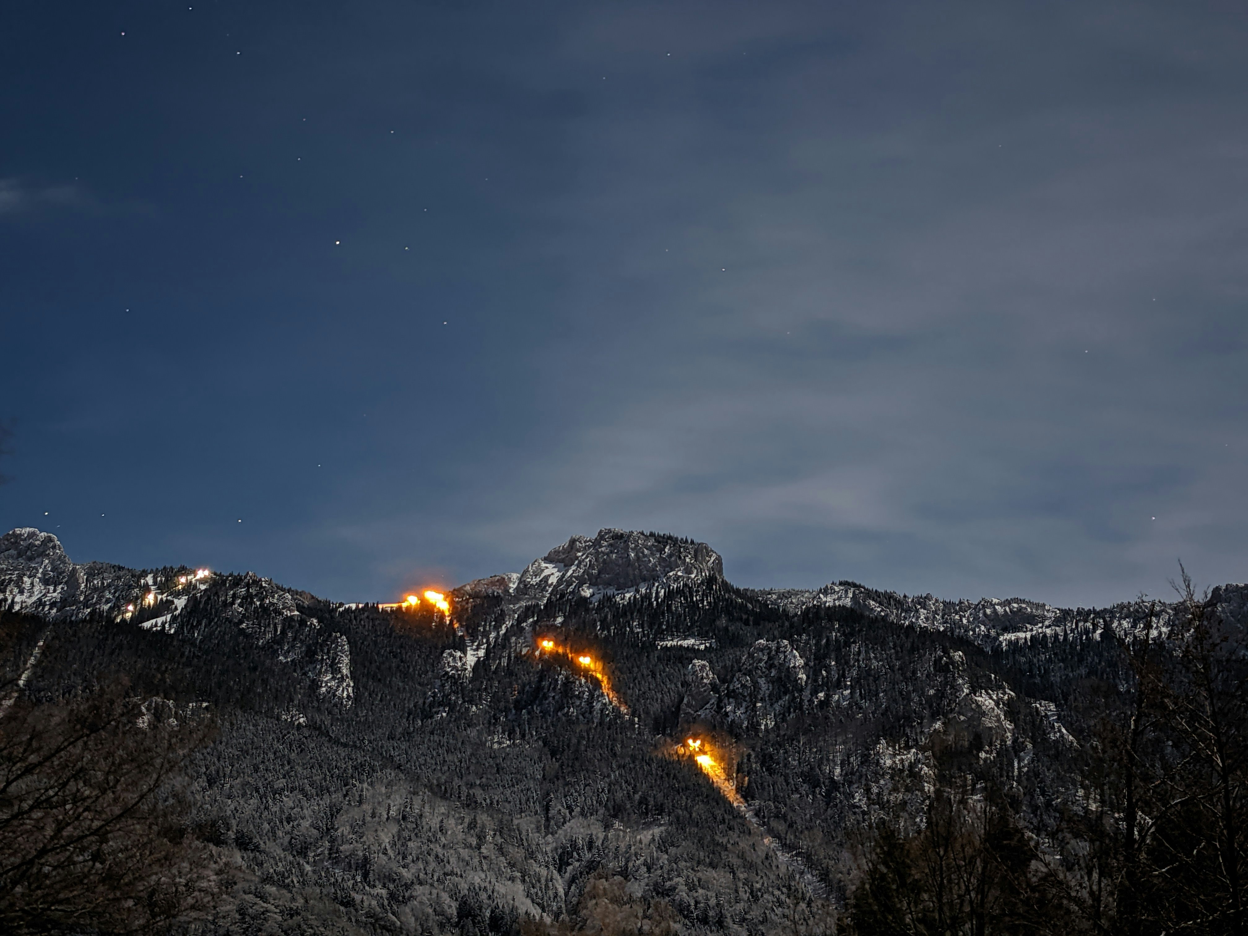 brown rocky mountain under blue sky during night time